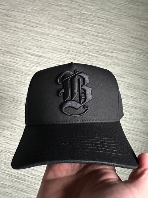 Black on black B SnapBack